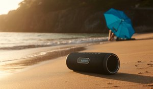 Caixa de som portatil na praia ideogram