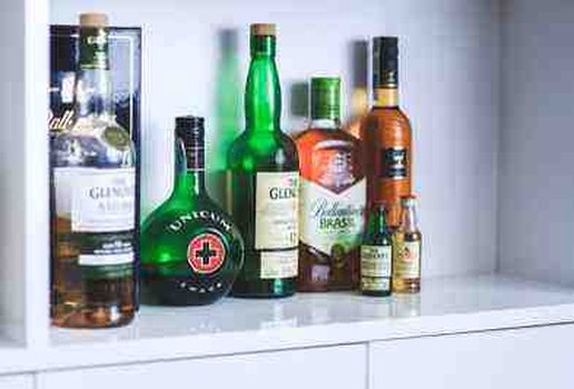 Alcohol bottles on shelf