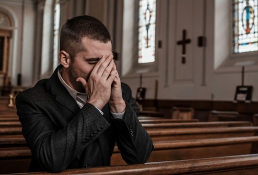 Man crying in church